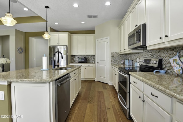 786 Jollymon Way, Daytona Beach, FL 32124 - kitchen featuring stainless steel appliances, a sink, dark wood-type flooring, white cabinets, and recessed lighting