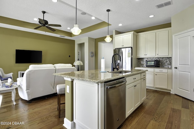 786 Jollymon Way, Daytona Beach, FL 32124 - kitchen featuring appliances with stainless steel finishes, a sink, open floor plan, dark wood-type flooring, and a textured ceiling