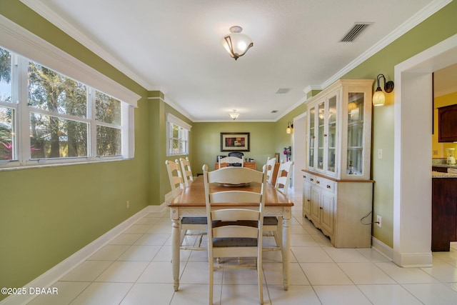 tiled dining area with crown molding