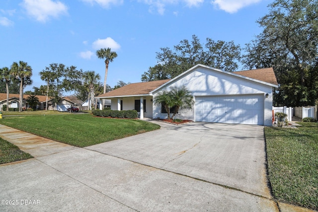 ranch-style home featuring a garage and a front yard