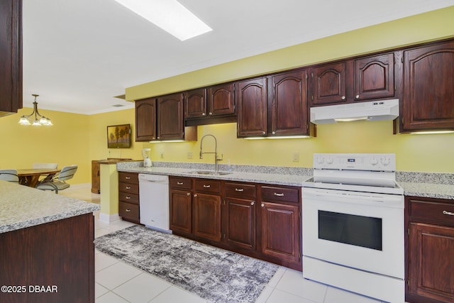 kitchen featuring sink, pendant lighting, white appliances, and light tile patterned floors