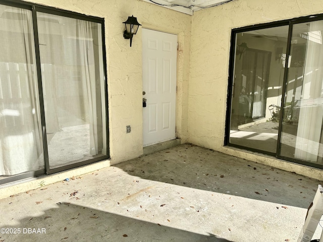 doorway to property featuring a patio area