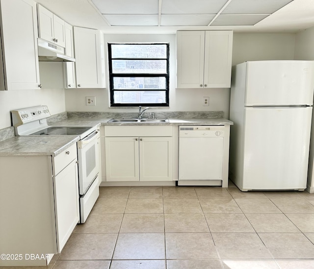 kitchen featuring light tile patterned flooring, white appliances, sink, and white cabinets