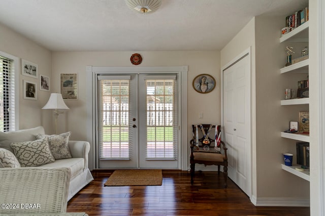 doorway with dark hardwood / wood-style flooring and french doors