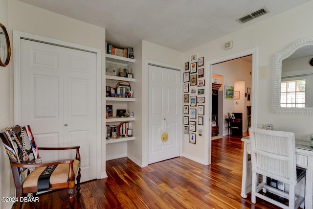 living area with dark hardwood / wood-style floors