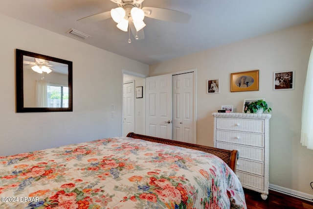 bedroom featuring dark hardwood / wood-style flooring and ceiling fan