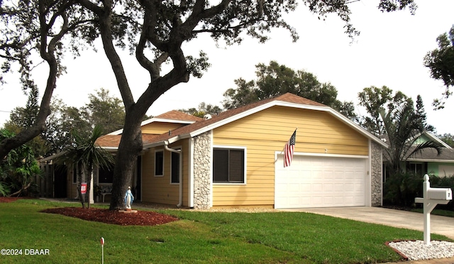 single story home with a garage and a front yard