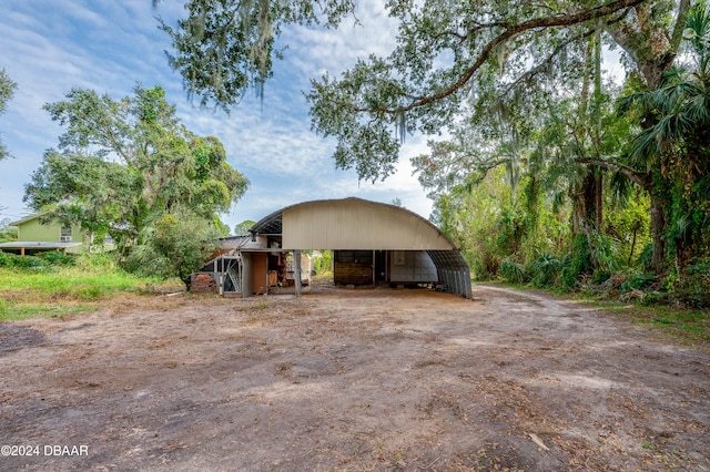 view of front of house featuring an outbuilding