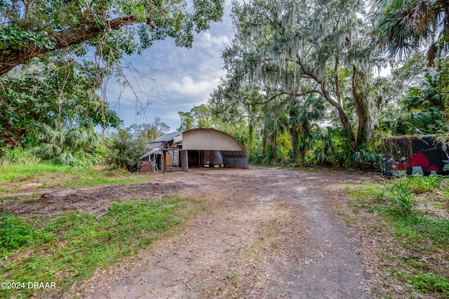 view of front of house with an outdoor structure