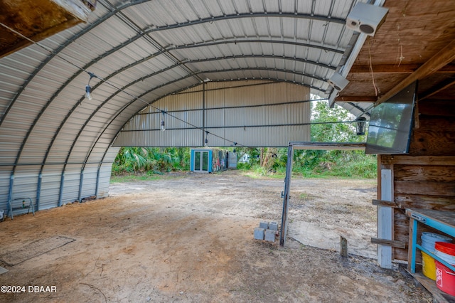 view of parking / parking lot featuring a carport