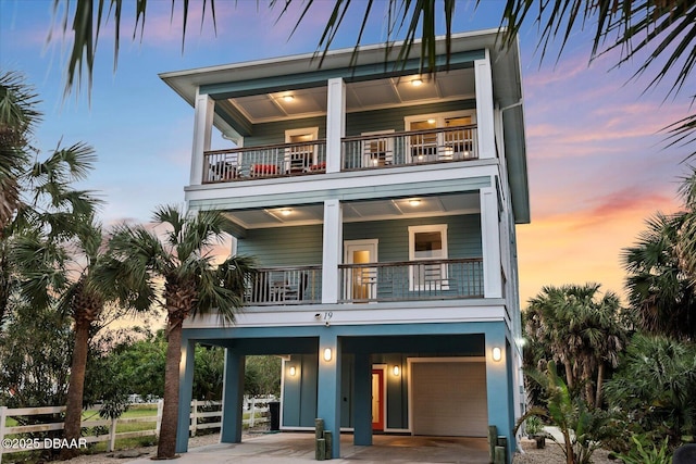 exterior space featuring a garage and a balcony