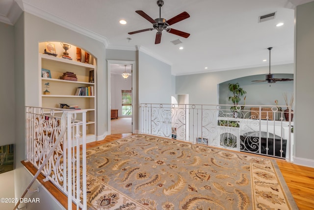 100 Emerald Lake Dr, Palm Coast, FL 32137 - bedroom with wood finished floors, ornamental molding, recessed lighting, and baseboards