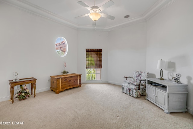 100 Emerald Lake Dr, Palm Coast, FL 32137 - living area with crown molding, light carpet, a ceiling fan, baseboards, and a tray ceiling