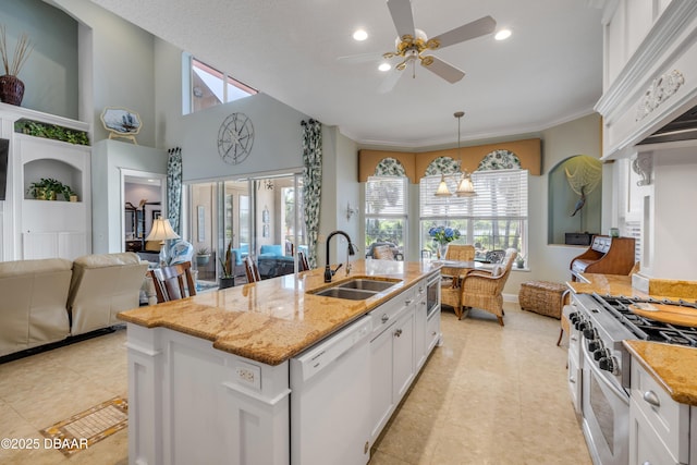 100 Emerald Lake Dr, Palm Coast, FL 32137 - kitchen featuring white dishwasher, a sink, premium range hood, white cabinetry, and ceiling fan