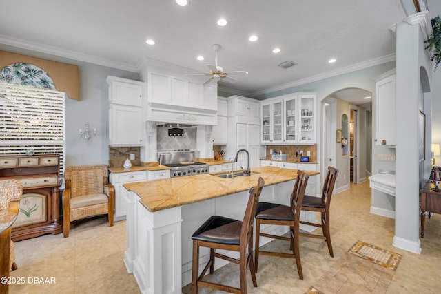 100 Emerald Lake Dr, Palm Coast, FL 32137 - kitchen featuring a sink, stove, a ceiling fan, recessed lighting, and ornamental molding