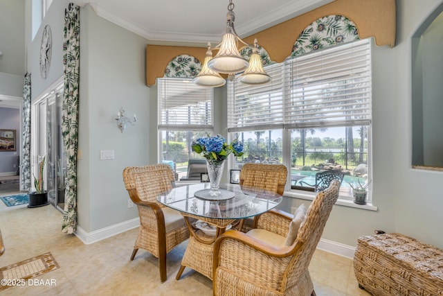 100 Emerald Lake Dr, Palm Coast, FL 32137 - dining space featuring ornamental molding, baseboards, and arched walkways
