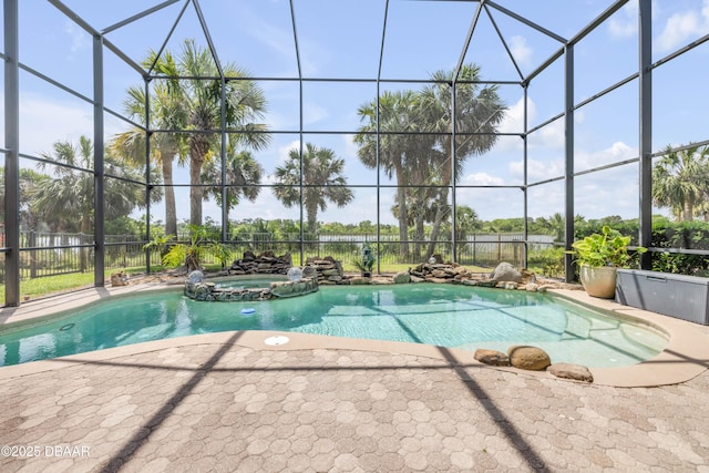 100 Emerald Lake Dr, Palm Coast, FL 32137 - view of pool featuring a patio, glass enclosure, and a pool with connected hot tub