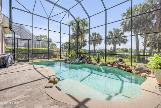 100 Emerald Lake Dr, Palm Coast, FL 32137 - view of pool with a pool with connected hot tub, glass enclosure, and a patio