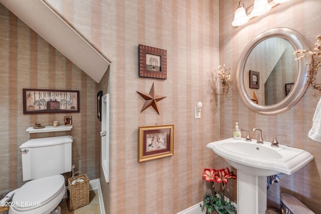 100 Emerald Lake Dr, Palm Coast, FL 32137 - bathroom featuring wallpapered walls, toilet, and baseboards