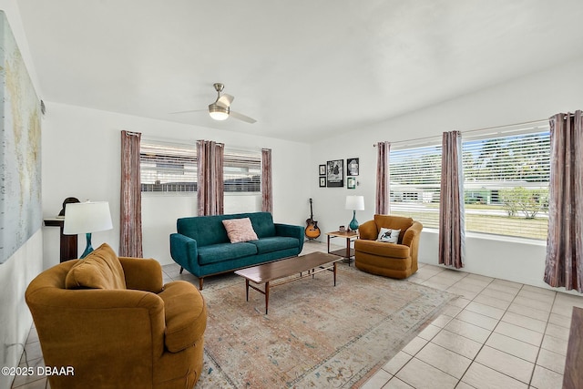 living room with ceiling fan and light tile patterned flooring