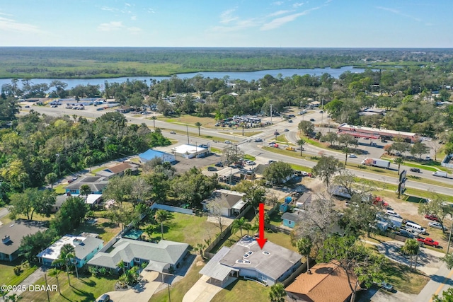 birds eye view of property with a water view