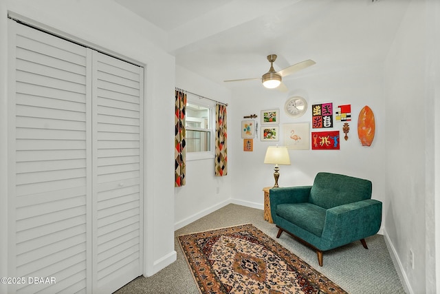 living area featuring ceiling fan and carpet floors