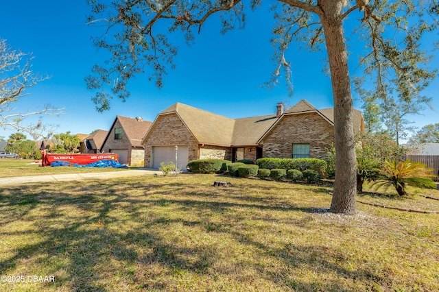 view of front of home with a garage and a front yard