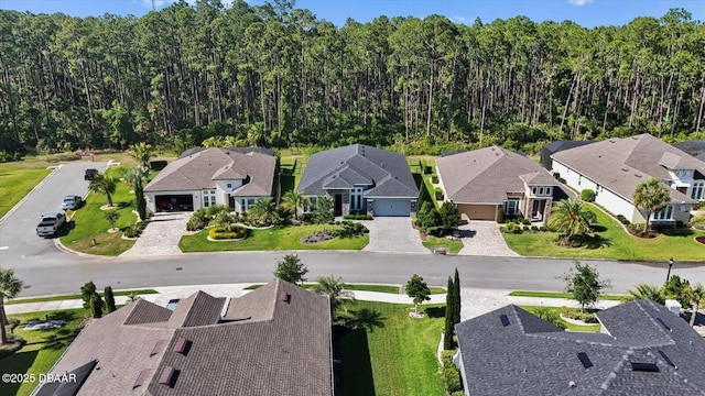 aerial view with a residential view and a wooded view