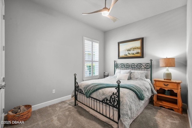 carpeted bedroom featuring baseboards and ceiling fan