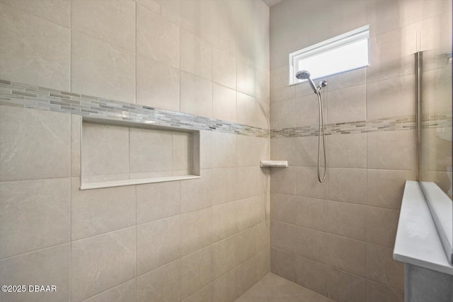 full bath featuring tiled shower