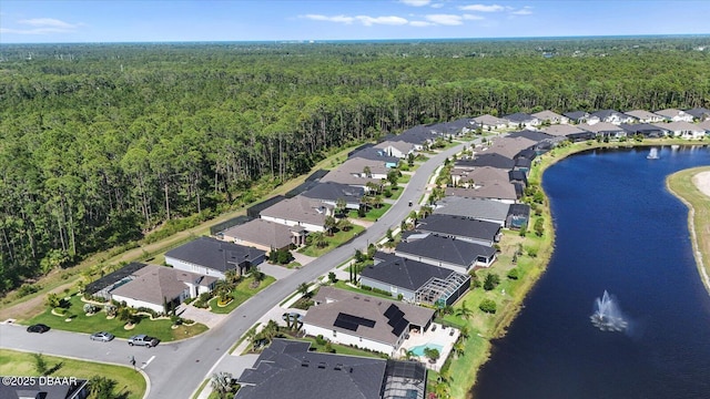 bird's eye view featuring a residential view, a water view, and a forest view