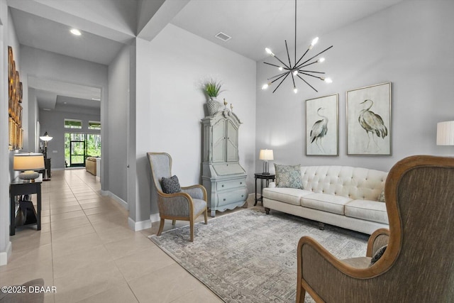 living room with visible vents, baseboards, a notable chandelier, and light tile patterned flooring