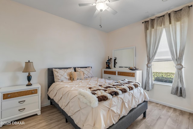 bedroom with light wood-type flooring and ceiling fan