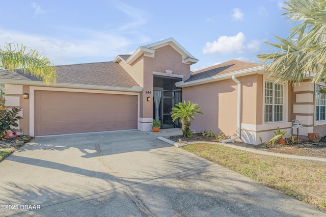 view of front of property with a garage