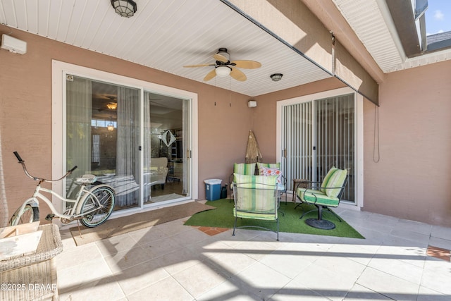 view of patio / terrace featuring ceiling fan