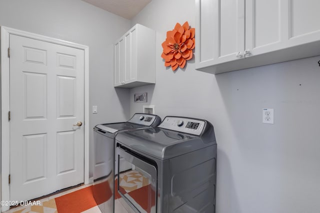 laundry area featuring cabinets and independent washer and dryer