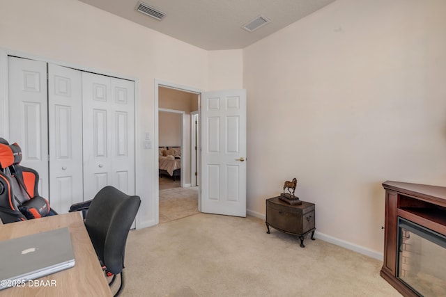 office space with light colored carpet