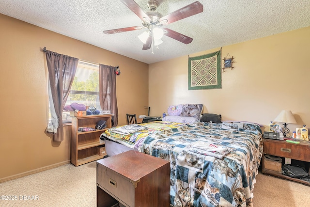 bedroom featuring baseboards, carpet flooring, a textured ceiling, and ceiling fan