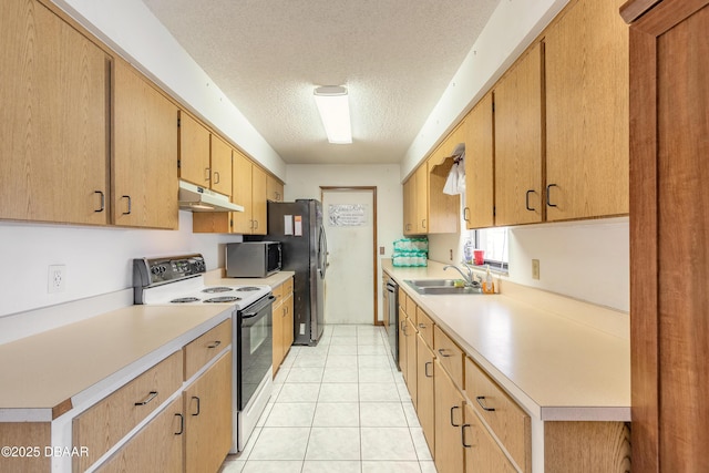 kitchen featuring a sink, a textured ceiling, stainless steel appliances, light countertops, and under cabinet range hood