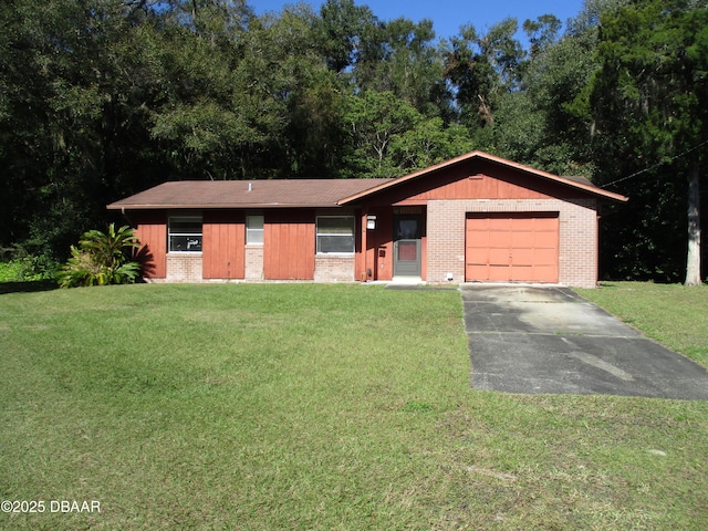 single story home featuring a garage and a front yard