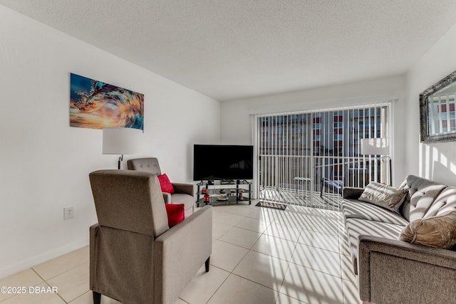 living room featuring light tile patterned floors and a textured ceiling