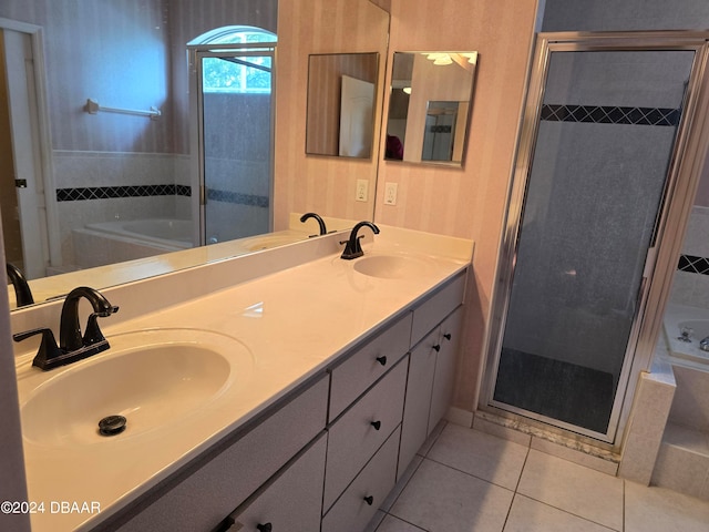 bathroom featuring tile patterned flooring, vanity, and independent shower and bath