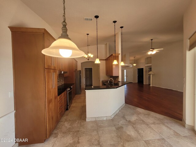 unfurnished living room with ceiling fan, dark wood-type flooring, and lofted ceiling