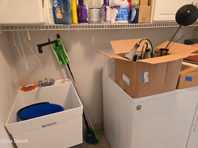 laundry area with washer / dryer and sink