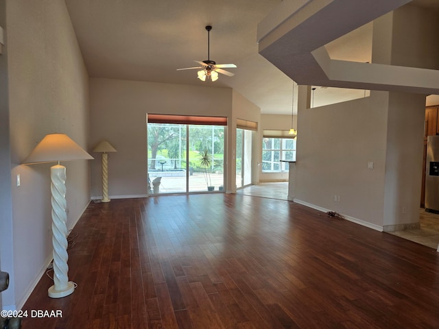 unfurnished living room with hardwood / wood-style flooring, ceiling fan, and lofted ceiling