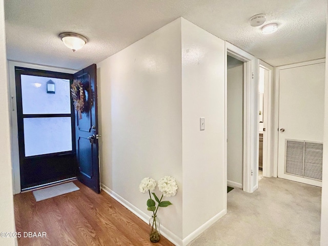 entrance foyer featuring a textured ceiling