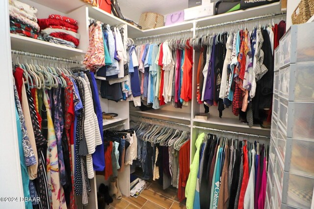 walk in closet featuring hardwood / wood-style flooring