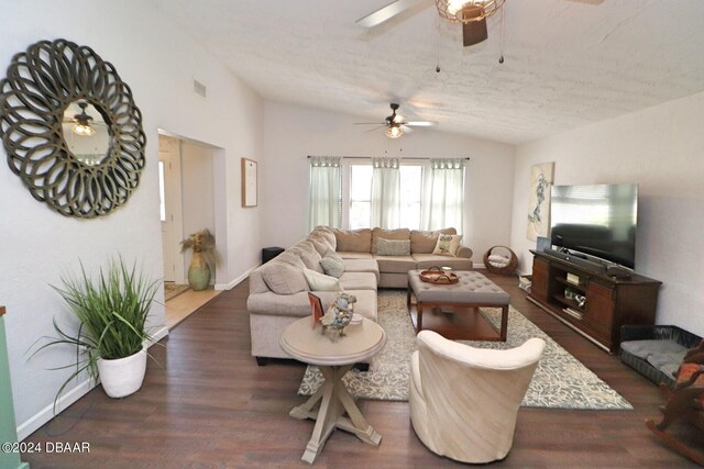 living room featuring ceiling fan, dark hardwood / wood-style floors, a textured ceiling, and vaulted ceiling