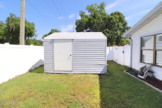 view of outdoor structure with a lawn