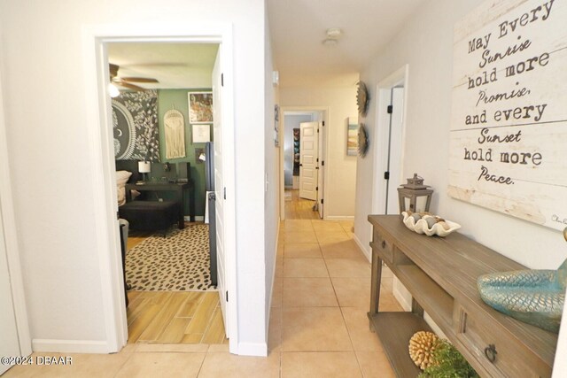 corridor with light hardwood / wood-style flooring